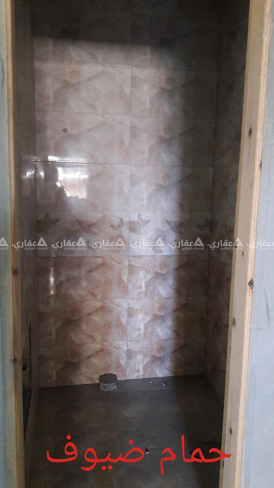 شقة بوسط الرمال شارع الثورة بعمارة سكنية حديثة البناء