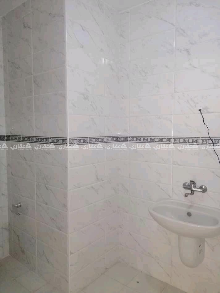 شقة للبيع في عمارة فاخرة فندقية الخدمات