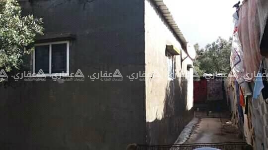 قطعه أرض مبني عليها منزل