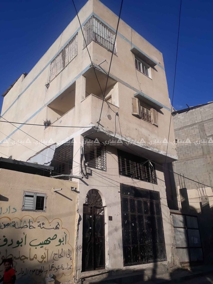 عمارة بالقرب من مسجد الشمعة