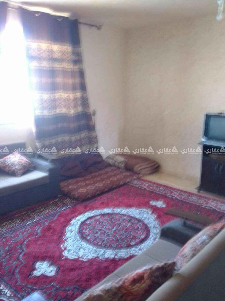 أرض مع منزل في المنطقة الزراعية