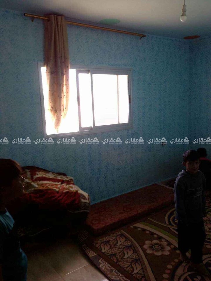 أرض مع منزل في المنطقة الزراعية
