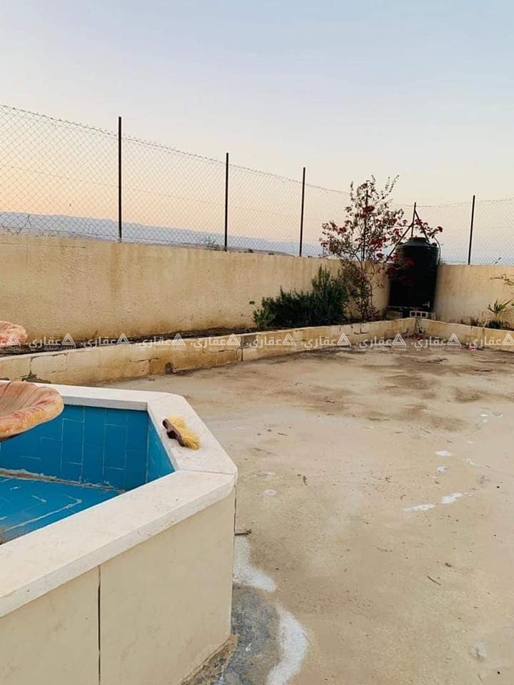 قطعة أرض مع بناء للبيع في منطقة رائعة جداً