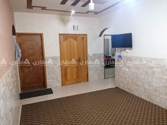 قطعة أرض مبني عليها منزل للبيع في حي البراق